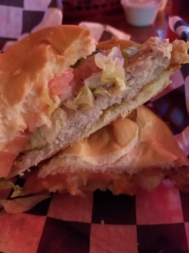 Pork Chop Sandwich with Lettuce and Tomato